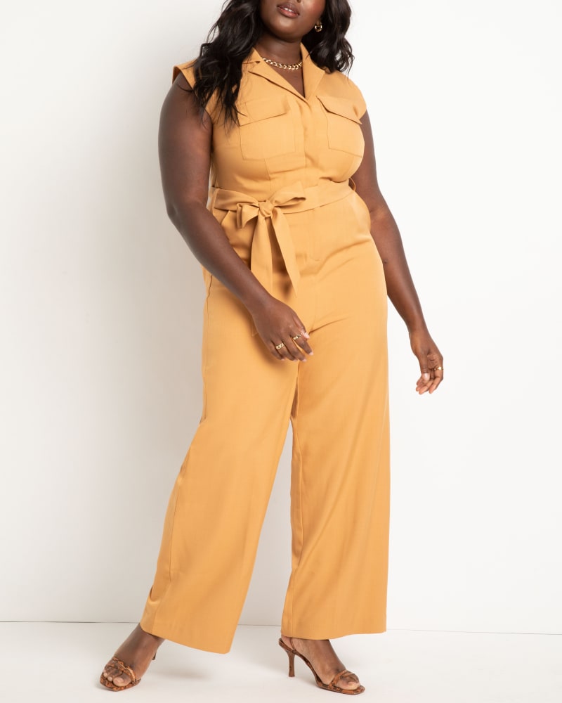 Front of a model wearing a size 16 Belted Jumpsuit in Biscuit by ELOQUII. | dia_product_style_image_id:272788